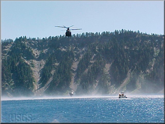 Chinook helicopter launching reasearch boat on Crater Lake.